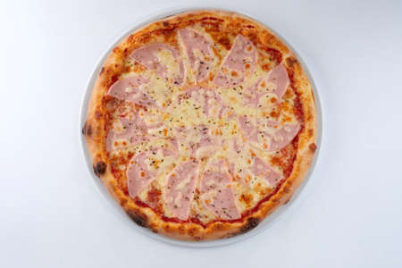 fresh pizza on the white plateの写真素材