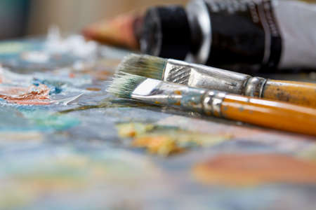 in the artist's studio, oil paints, palette, brushesの写真素材