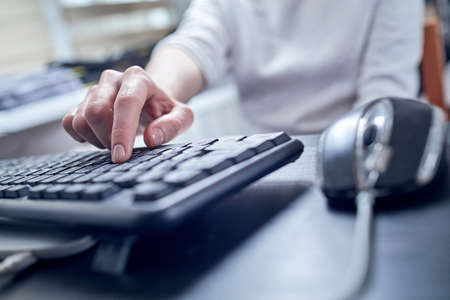 Female hands or woman office worker typing on the keyboardの写真素材