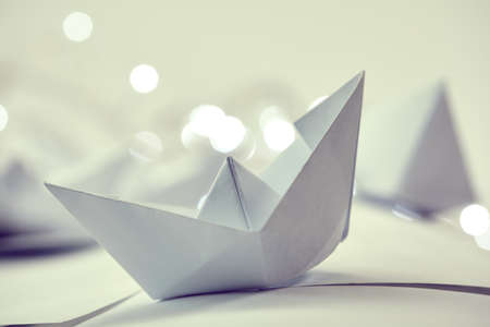 paper boats on the white