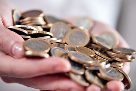euro coins in the handsの写真素材