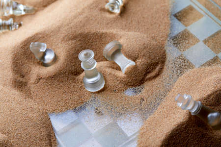 glass chess on the sandの写真素材