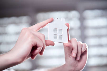 real estate concept, hand holding houseの写真素材