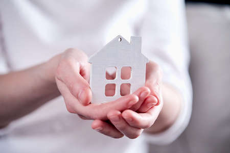 real estate concept, hand holding houseの写真素材