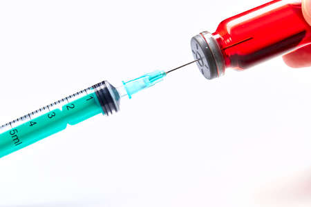 Vaccine in vial with syringeの写真素材