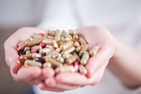 different pills in the handsの写真素材