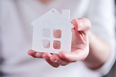 real estate concept, hand holding houseの写真素材