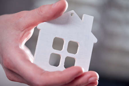 real estate concept, hand holding houseの写真素材