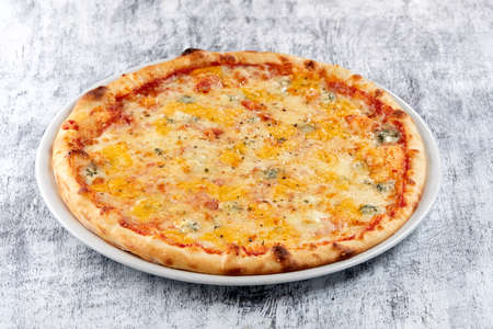 fresh pizza on the white plateの写真素材