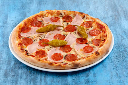 fresh pizza on the white plateの写真素材