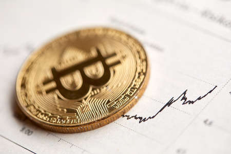 Gold Bitcoin on the background of the chart.の写真素材