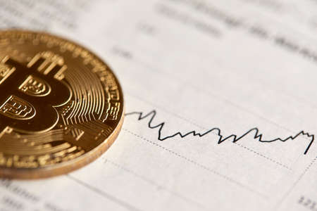Gold Bitcoin on the background of the chart.の写真素材