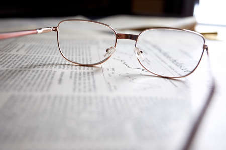 eyeglasses on the newspaper pagesの写真素材