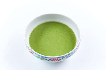 green cream soup with broccoliの写真素材