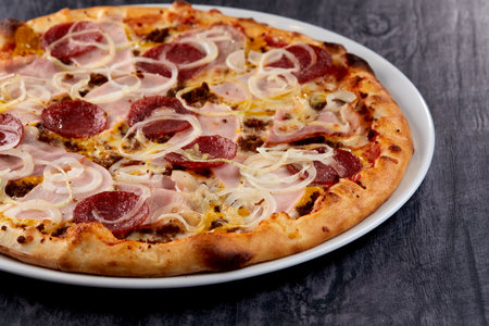 fresh pizza on the white plateの写真素材