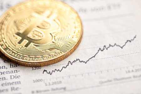 Gold Bitcoin on the background of the chart.の写真素材