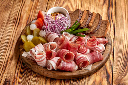 meat appetizer on the wooden backgroundの写真素材