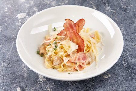 Pasta Carbonara on white plateの写真素材