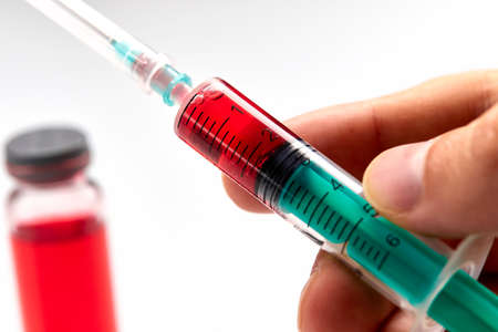 Vaccine in vial with syringeの写真素材