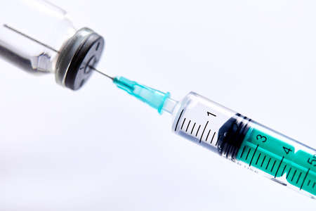 Vaccine in vial with syringeの写真素材