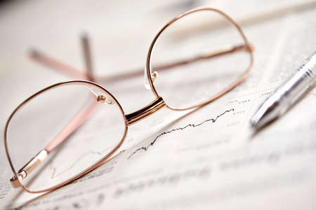 eyeglasses on the newspaper pagesの写真素材