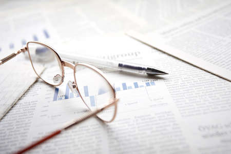 eyeglasses on the newspaper pagesの写真素材