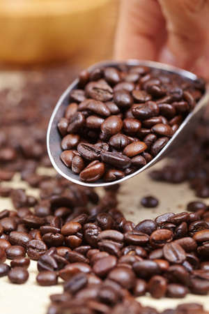 coffee beans in the spoonの写真素材
