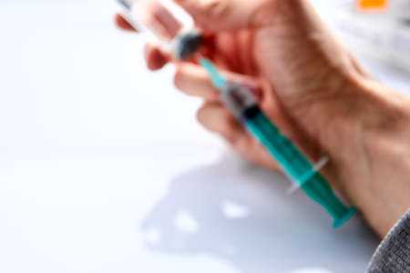 Vaccine in vial with syringeの写真素材