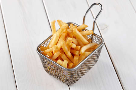 fried french fries in the basketの写真素材