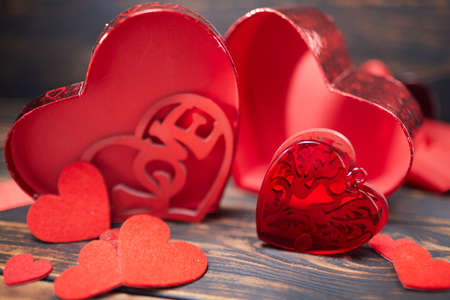 Valentine day greeting card. Hearts on the wooden backgroundの写真素材