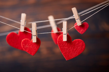 Red heart on wooden clothespinの写真素材