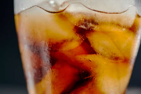 Ice cubes in cola beverageの写真素材