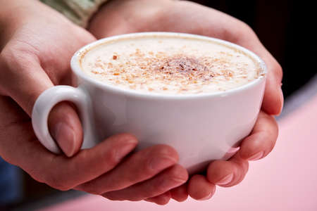 woman with cup of cappuccinoの写真素材