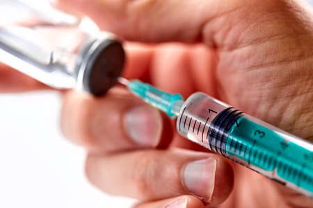 Vaccine in vial with syringeの写真素材