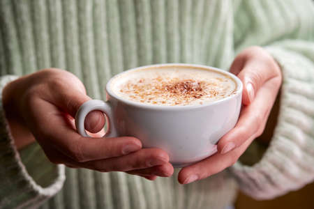 woman with cup of cappuccinoの写真素材