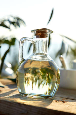 olive oil and green olives on the tableの写真素材