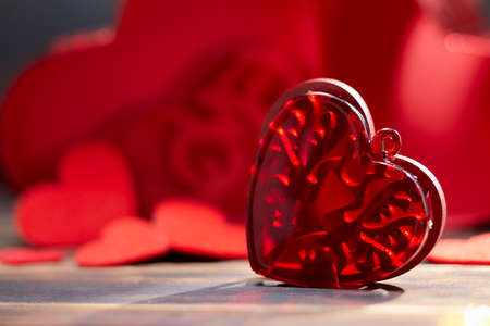 Valentine day greeting card. Hearts on the wooden backgroundの写真素材