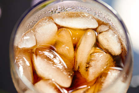 Ice cubes in cola beverageの写真素材