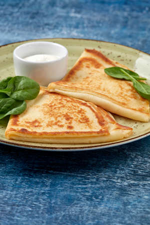 tasty breakfast with pancakes and herbsの写真素材