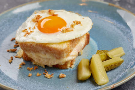 breakfast with fried egg and cheeseの写真素材
