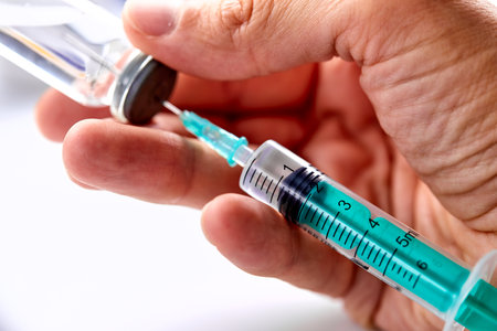 Vaccine in vial with syringeの写真素材