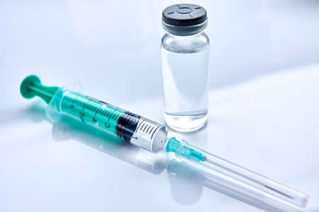 Vaccine in vial with syringeの写真素材