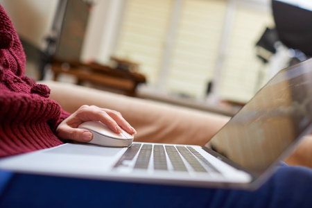 Beautiful woman relaxing at home with notebook
