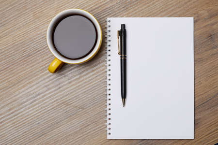 notebook on the table and coffeeの写真素材