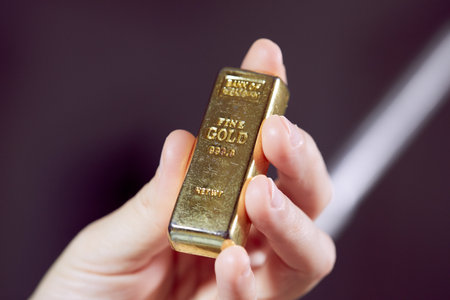 golden bar on the man's handの写真素材