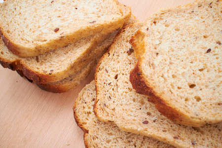 wholegrain toasts on the wooden boardの写真素材