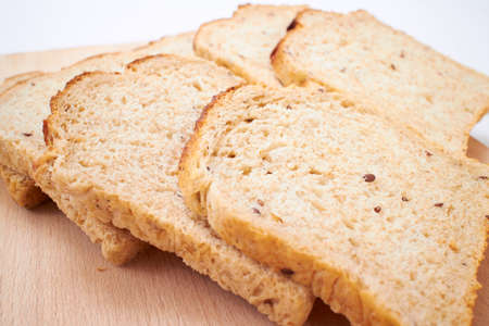 wholegrain toasts on the wooden boardの写真素材