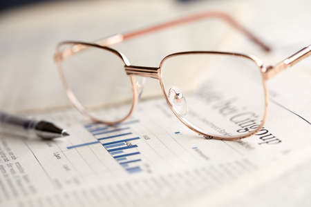 eyeglasses on the newspaper pagesの写真素材