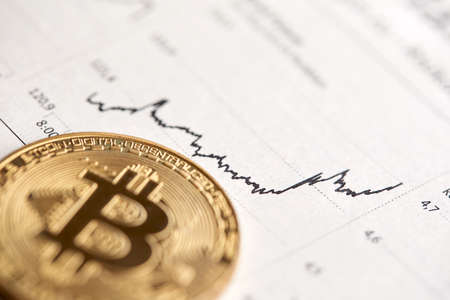 Gold Bitcoin on the background of the chart.の写真素材