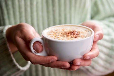woman with cup of cappuccinoの写真素材